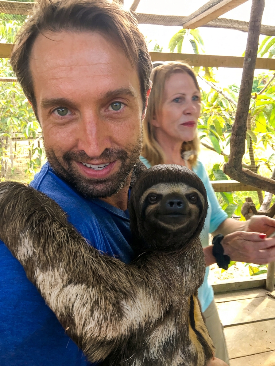 A calm moment with a sloth — an embodiment of unhurried, grounded presence.